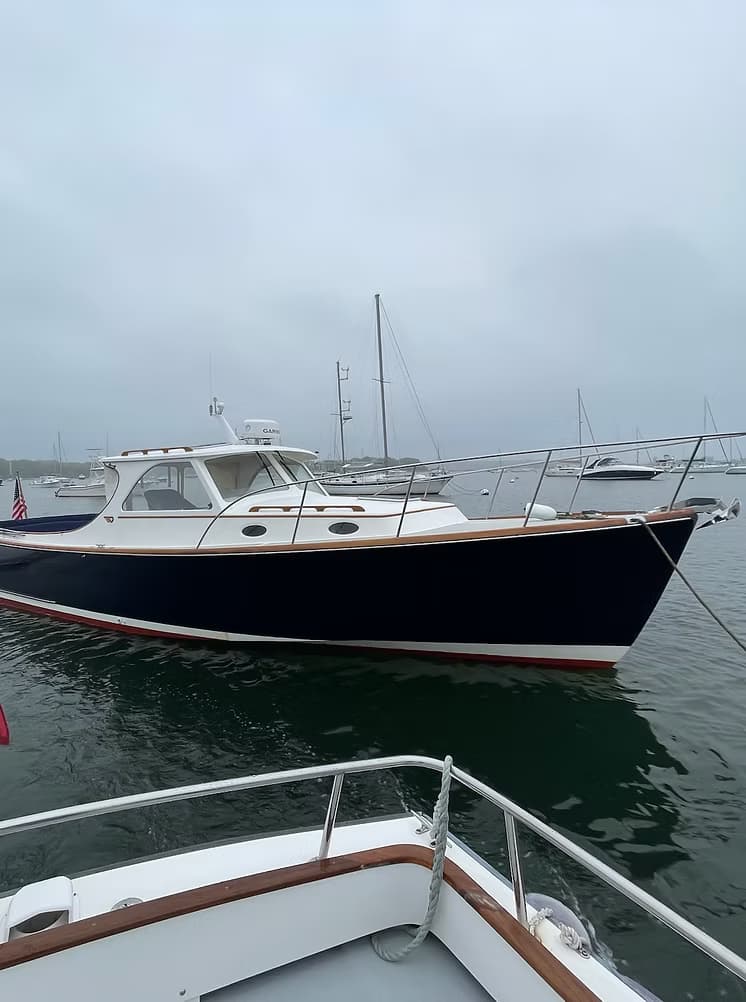 The boat on her mooring in soft morning mist